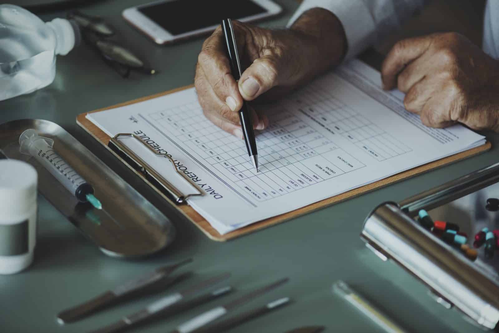 person holding black pen